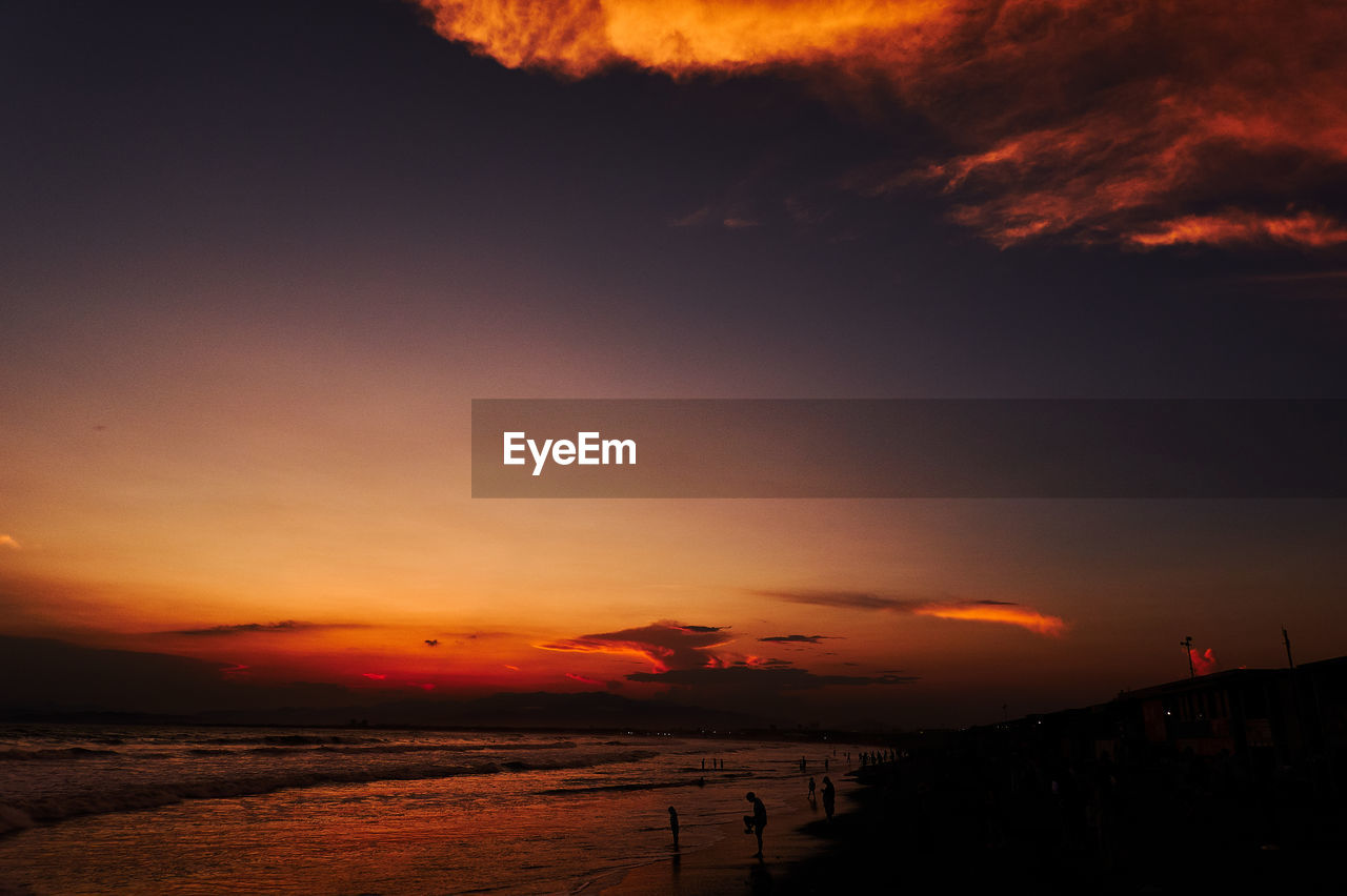 SCENIC VIEW OF SEA AGAINST ORANGE SKY