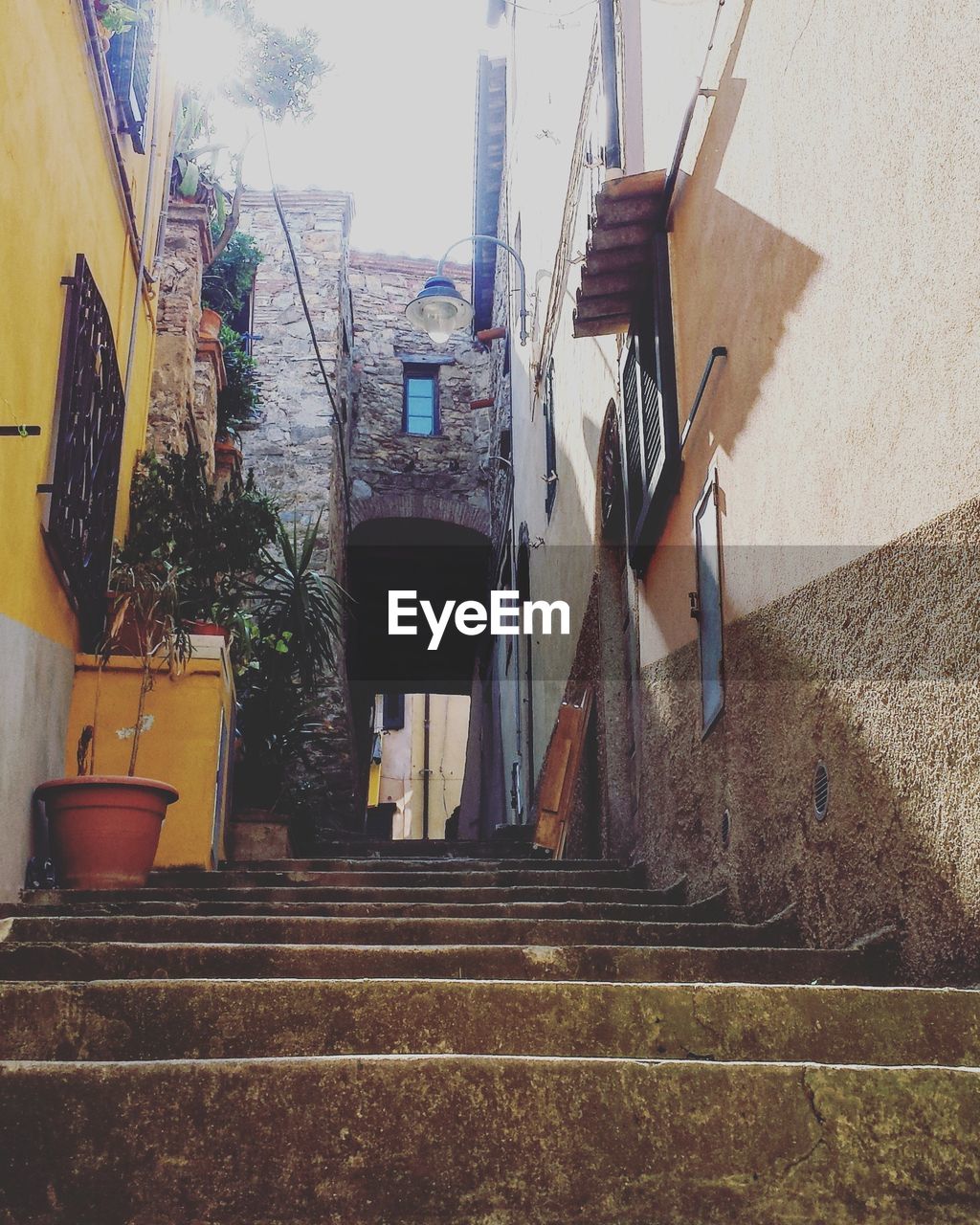 STAIRCASE AMIDST BUILDINGS IN CITY