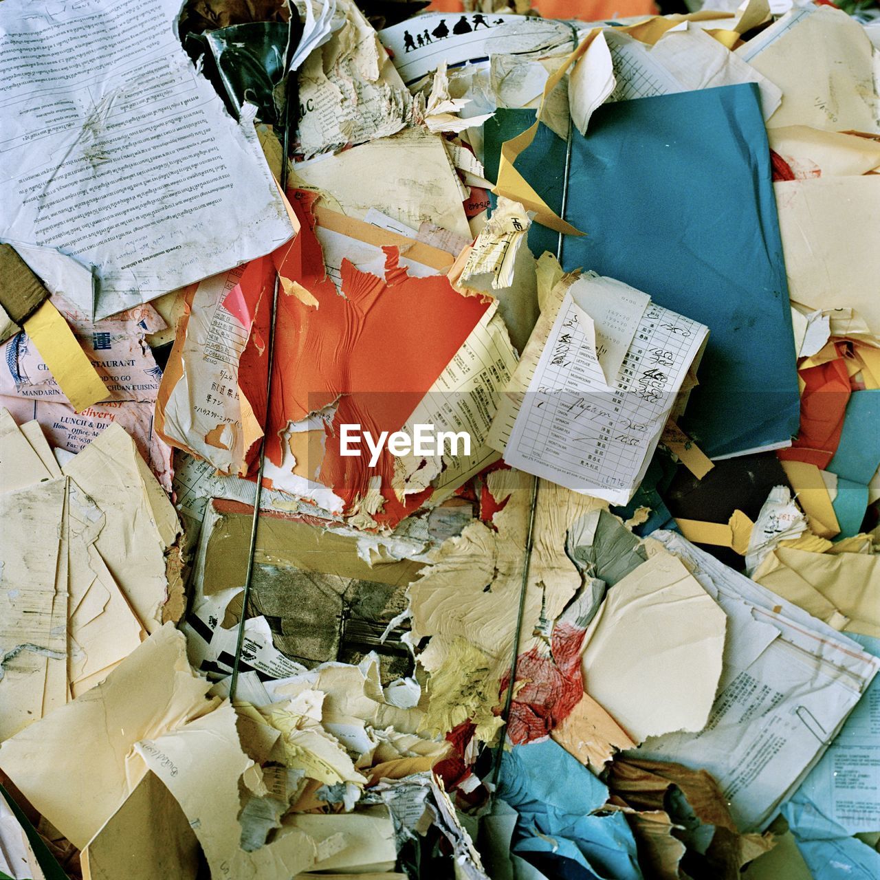 HIGH ANGLE VIEW OF GARBAGE BIN ON PAPER