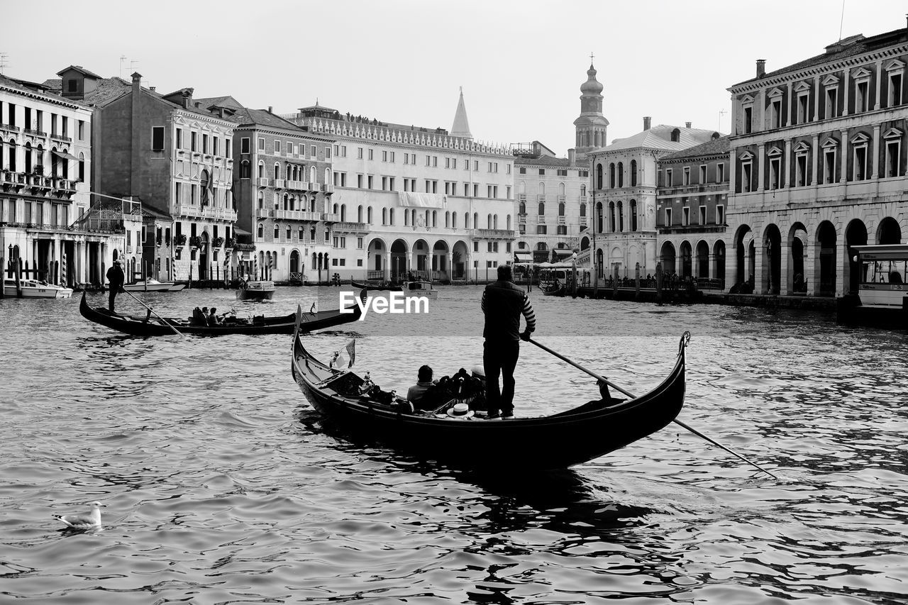 MAN IN BOAT IN CANAL