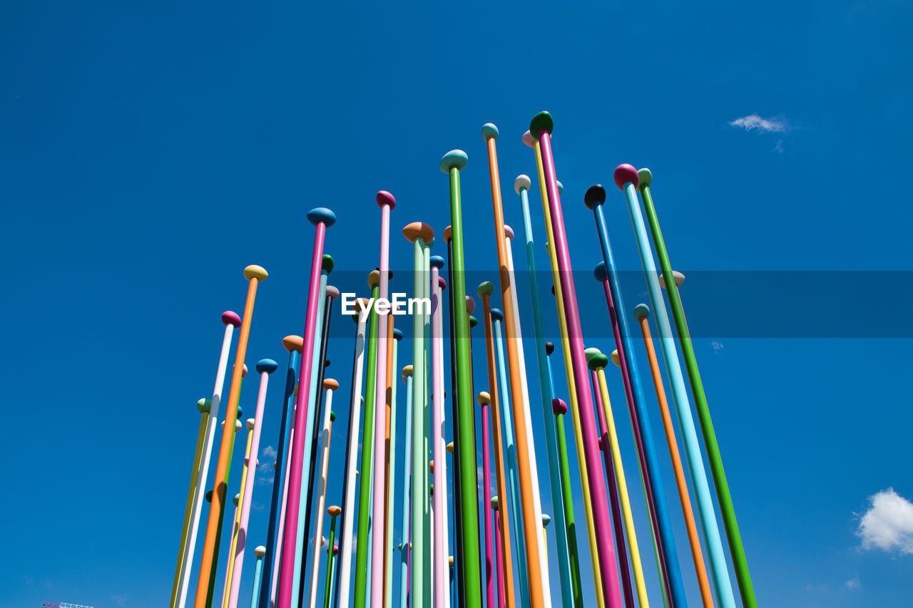 Coloris installation a representation of a world map, which stand about 100 pastel-color metal poles