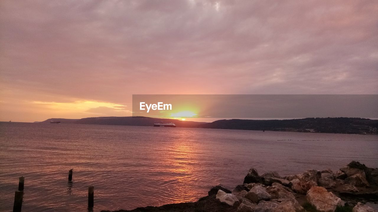 SCENIC VIEW OF SEA DURING SUNSET