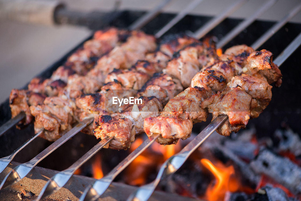 Close-up of meat on barbecue grill