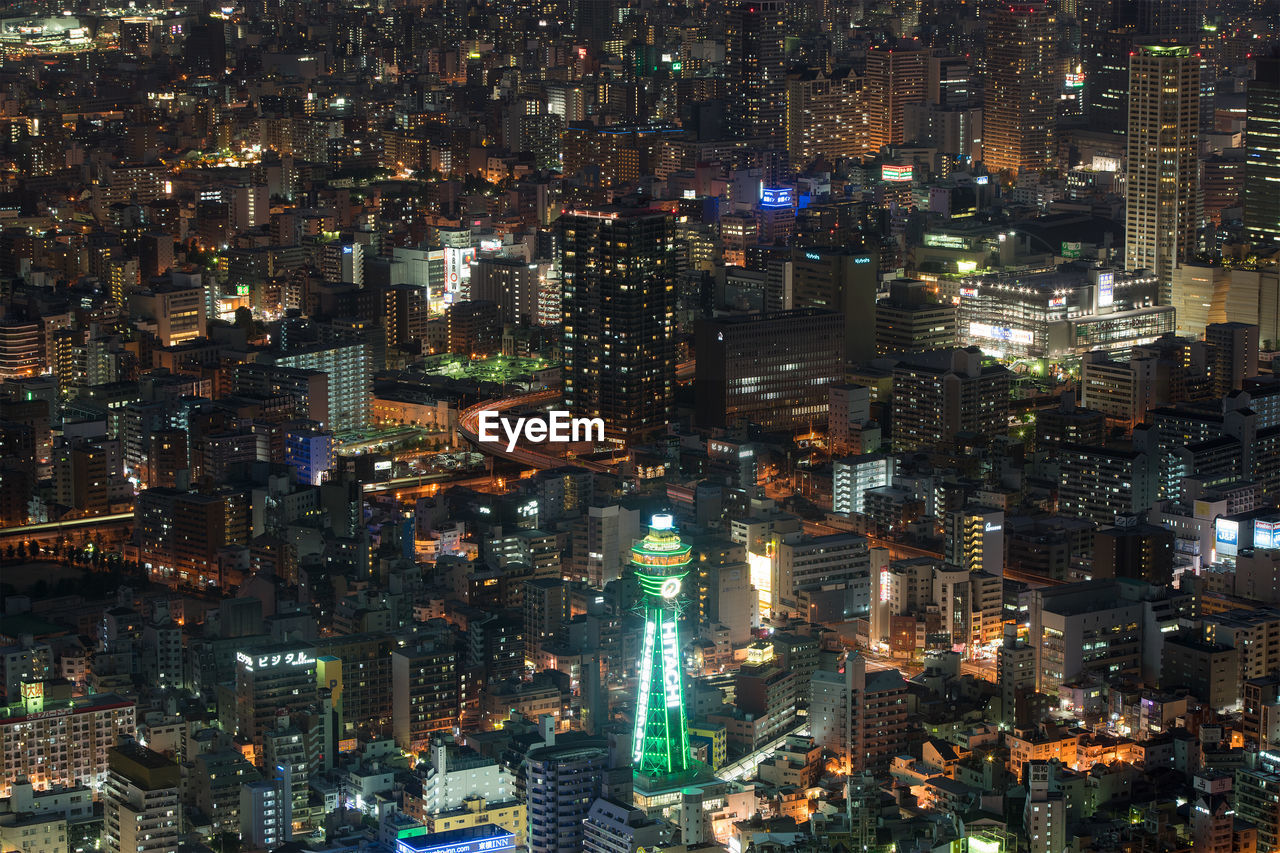 High angle view of illuminated tsutenkaku tower in city at night