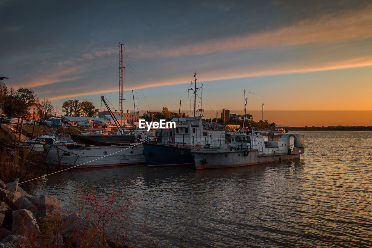 River boats in the parking lot in the evening.