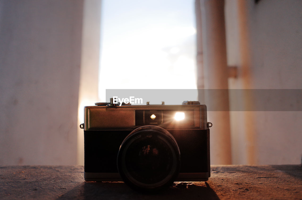 Close-up of vintage camera on table