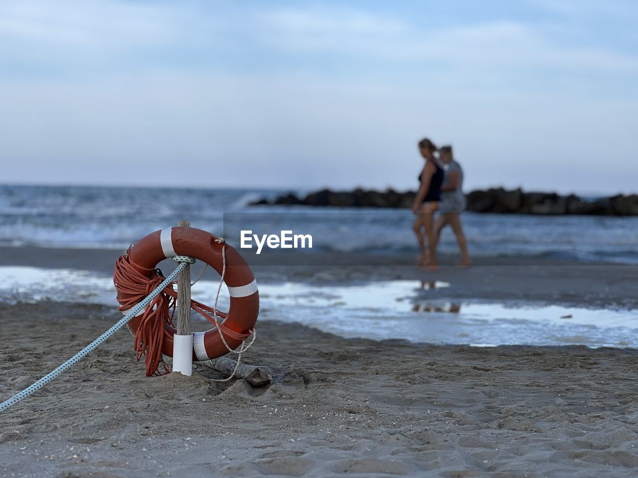 water, beach, sea, land, shore, coast, ocean, sand, sky, body of water, nature, wave, sports, motion, day, men, full length, horizon, adult, two people, beauty in nature, leisure activity, horizon over water, lifestyles, outdoors, person, wind wave, vacation