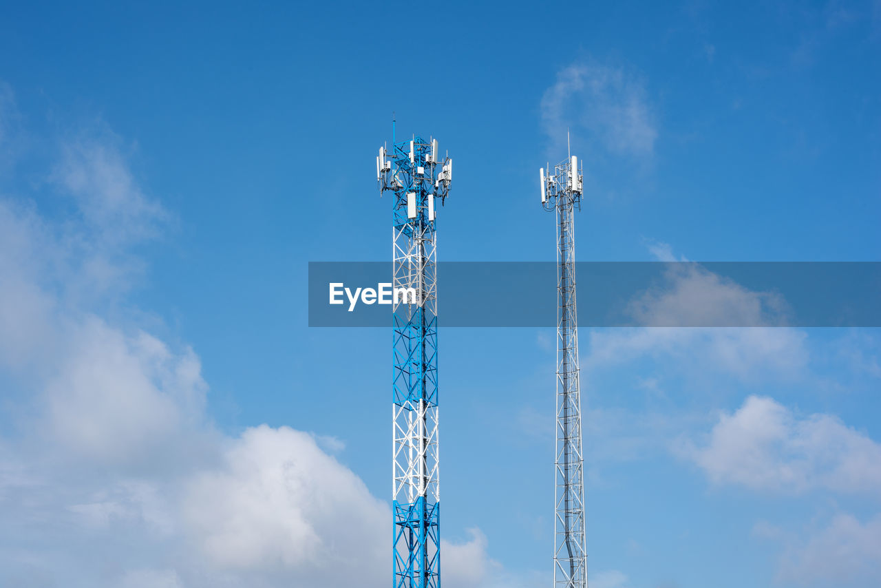 Wireless communication antenna transmitter. telecommunication towers with blue sky.