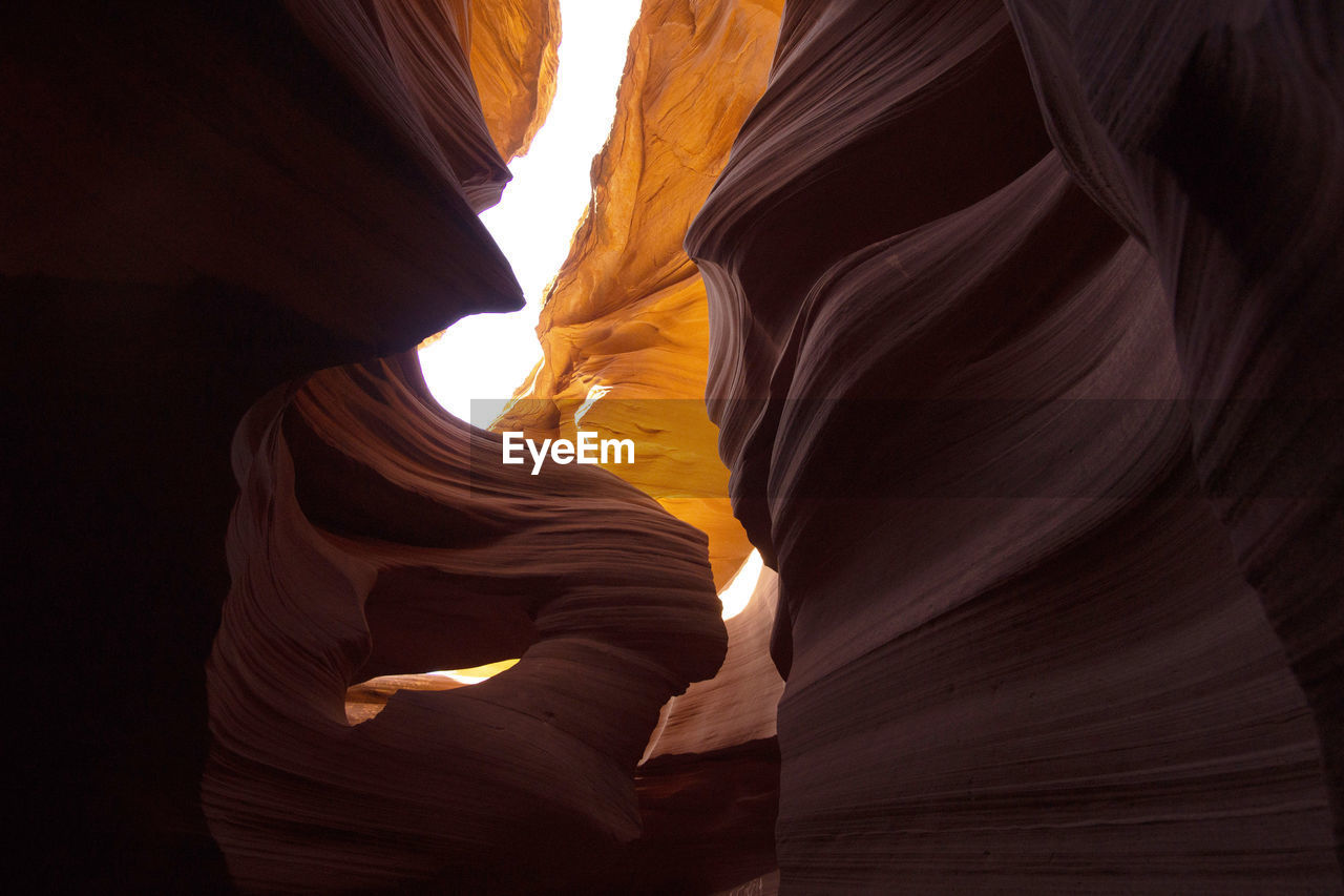 LOW ANGLE VIEW OF ROCK FORMATIONS AT CAVE