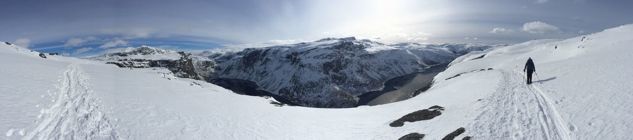 Panoramic view of snowcapped mountains against sky