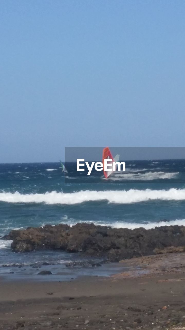 SCENIC VIEW OF SEA AGAINST SKY AT BEACH