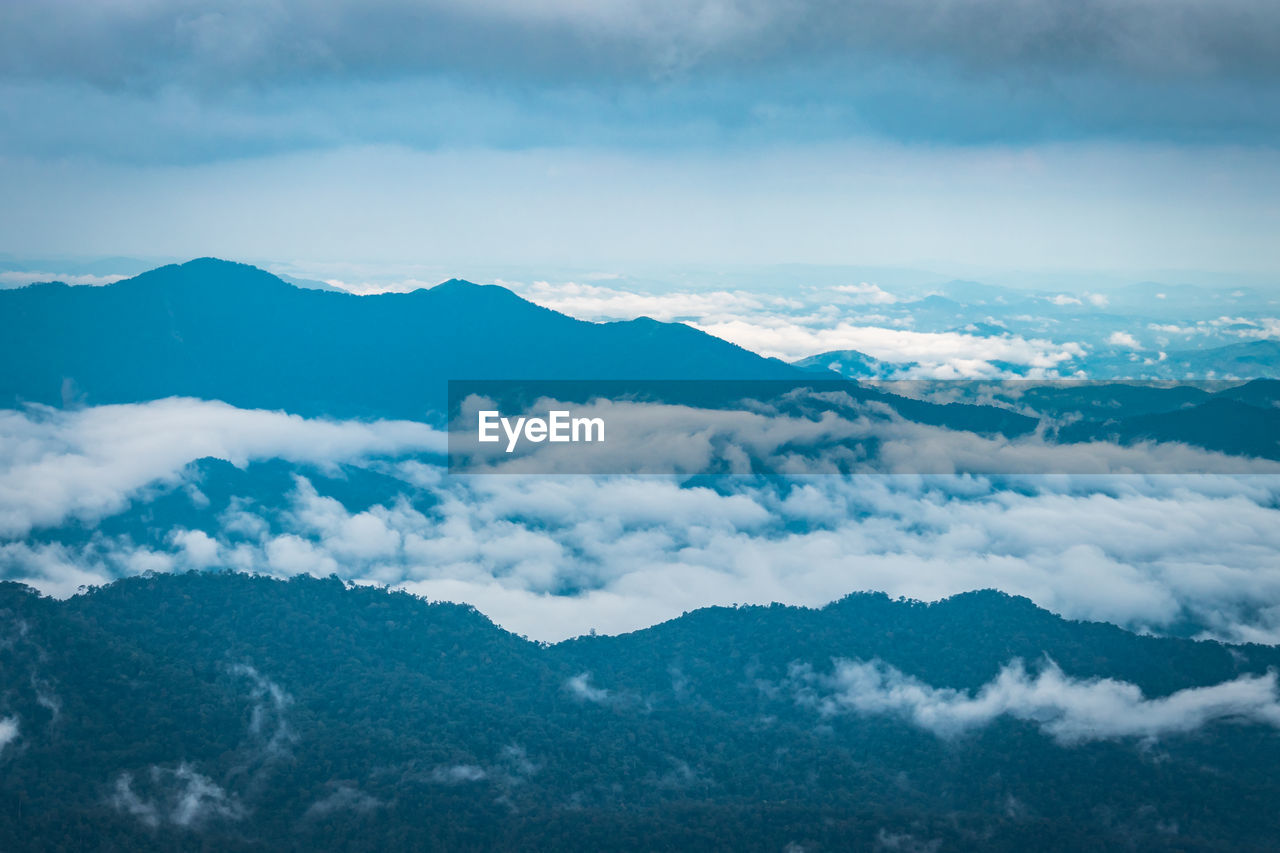 SCENIC VIEW OF CLOUDSCAPE OVER MOUNTAINS