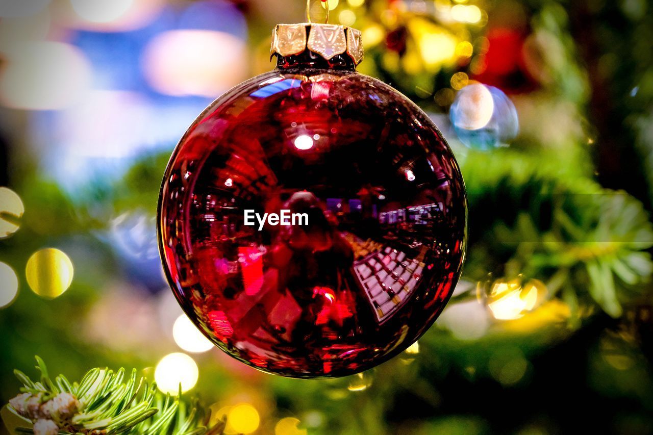 Close-up of bauble hanging on christmas tree