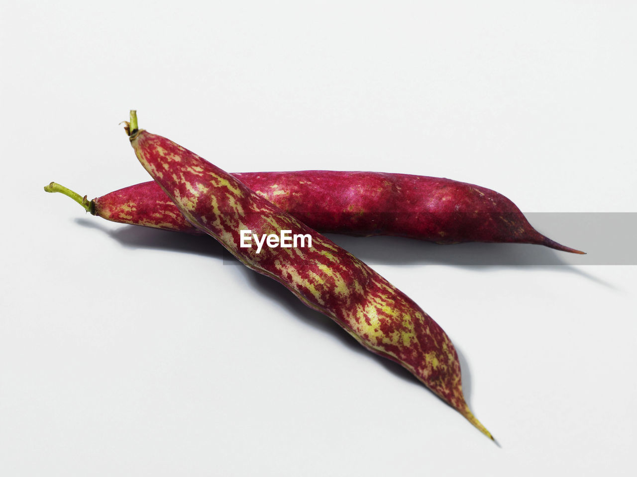 Group of borlotti beans over white background