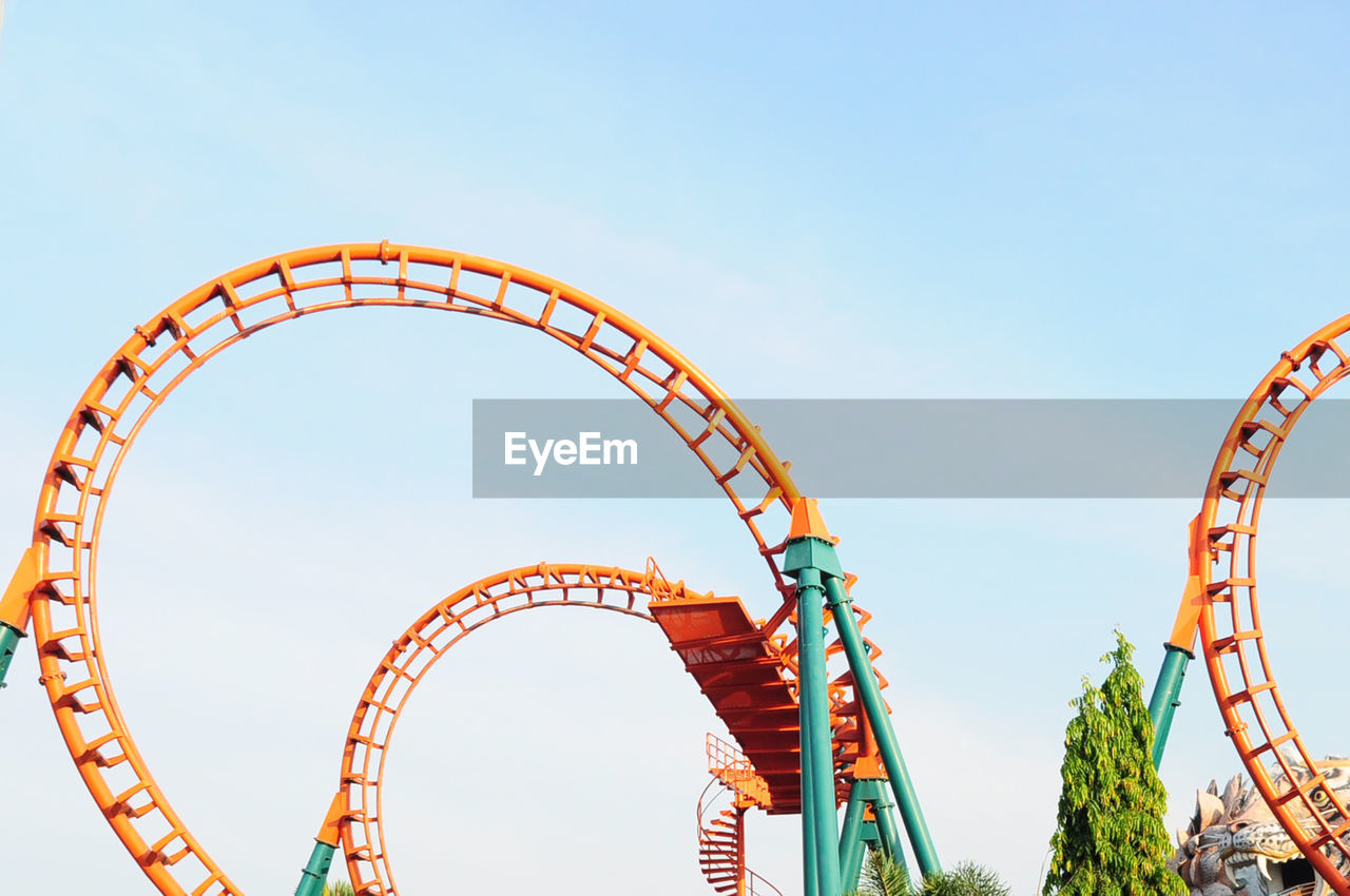 Low angle view of rollercoaster against sky