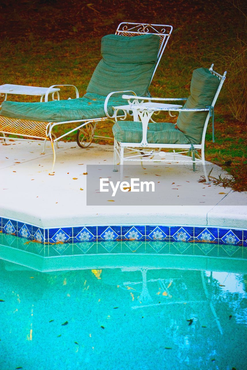 no people, swimming pool, chair, blue, indoors, day, water