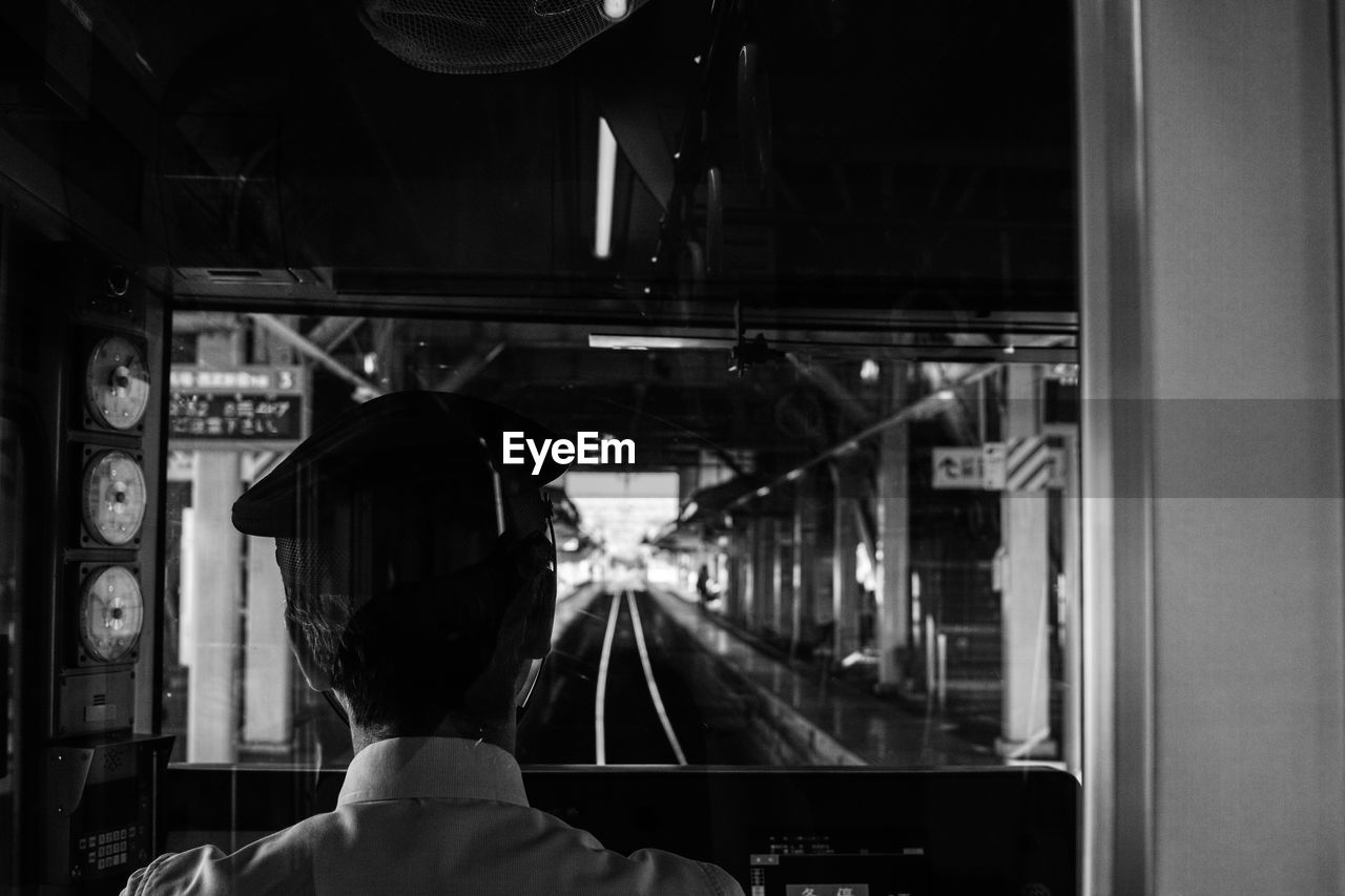 Rear view man in train