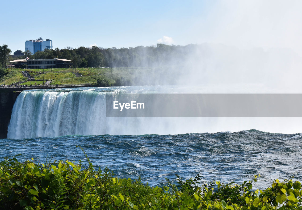 VIEW OF WATERFALL AGAINST SKY