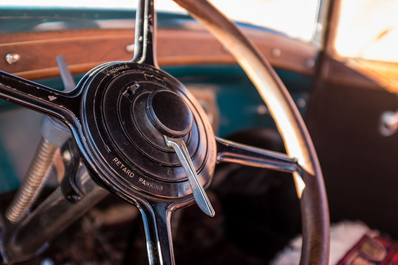 High angle view of rusty steering wheel in vintage car