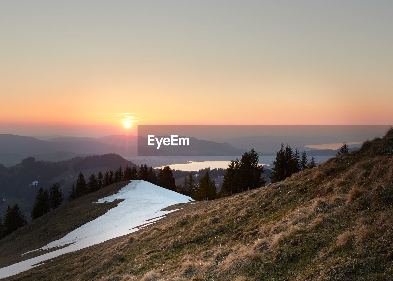 Scenic view of mountains against sky during sunset