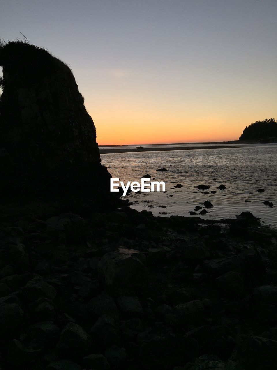 Scenic view of beach and sea against sky during sunset