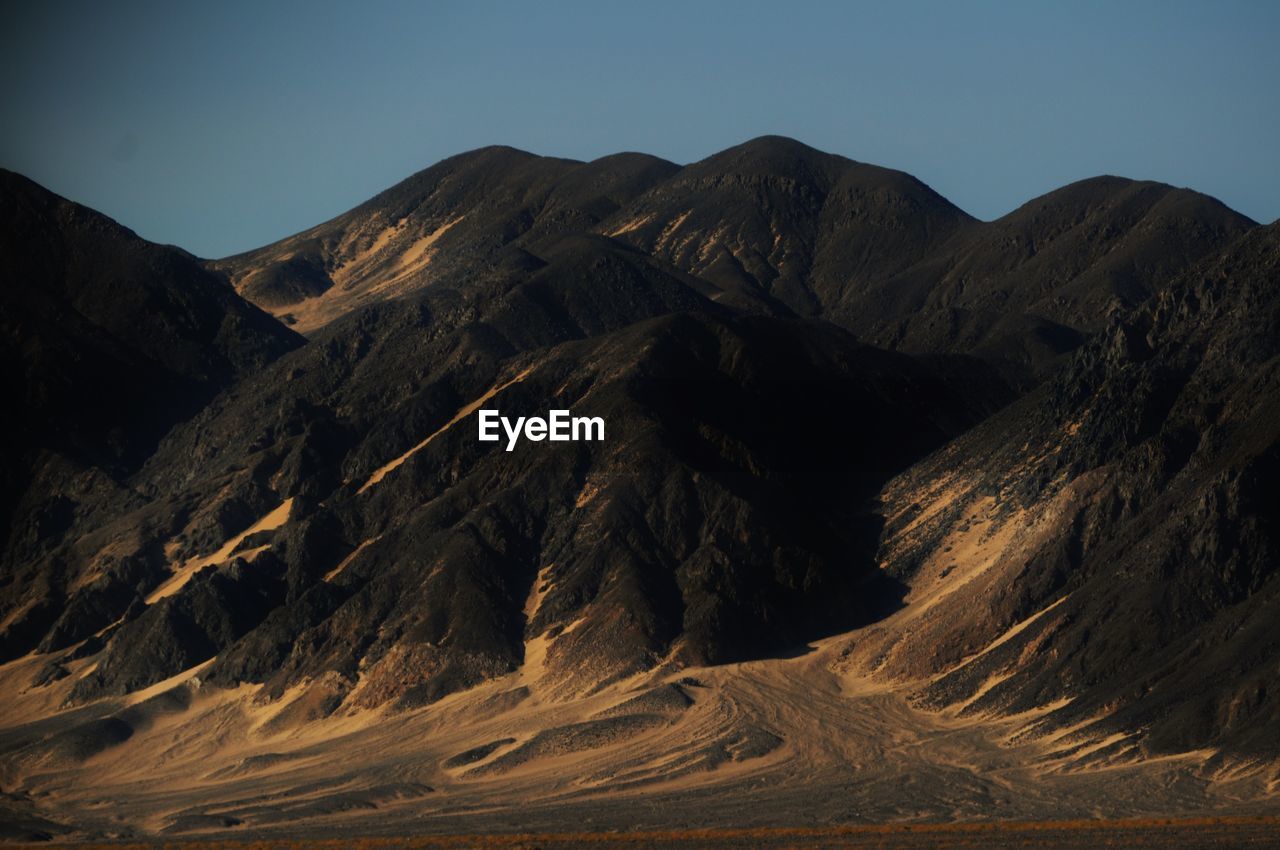 Scenic view of mountains against clear sky