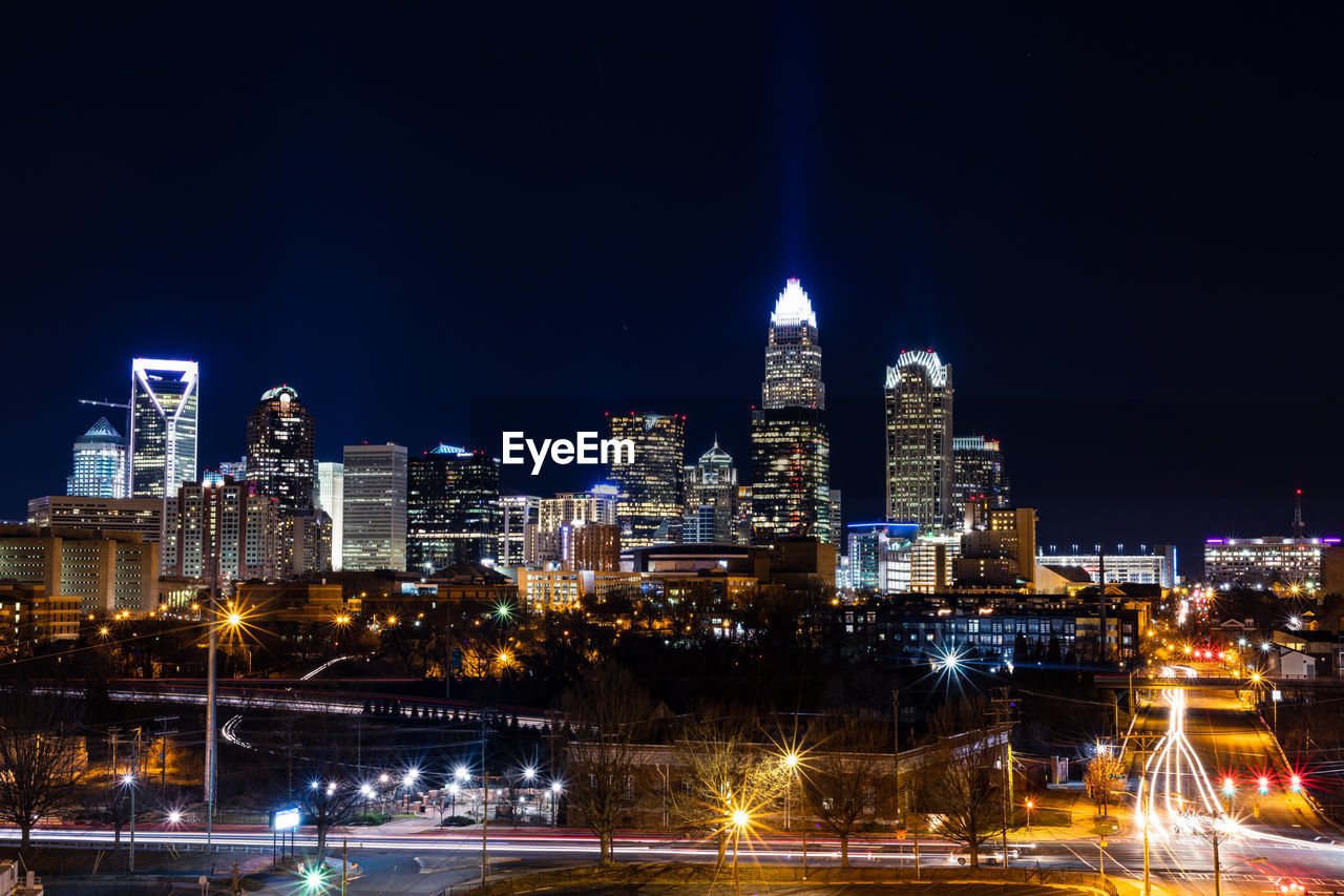 Illuminated buildings in city at night