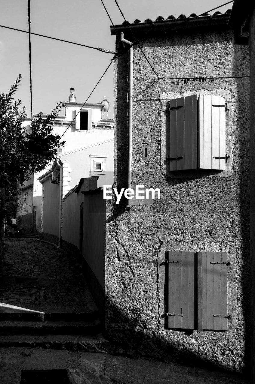 Alley amidst buildings in city