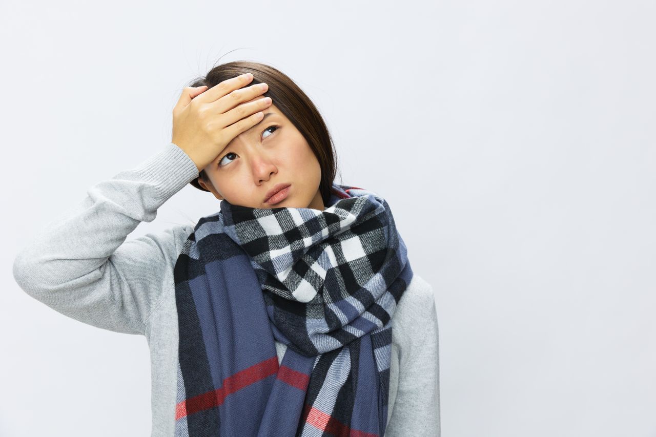 portrait of woman standing against white background