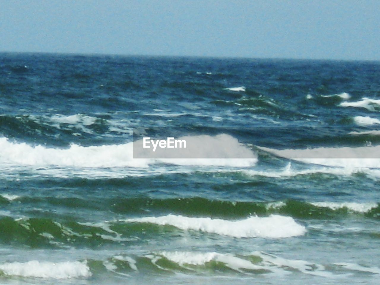 WAVES IN SEA AGAINST CLEAR SKY