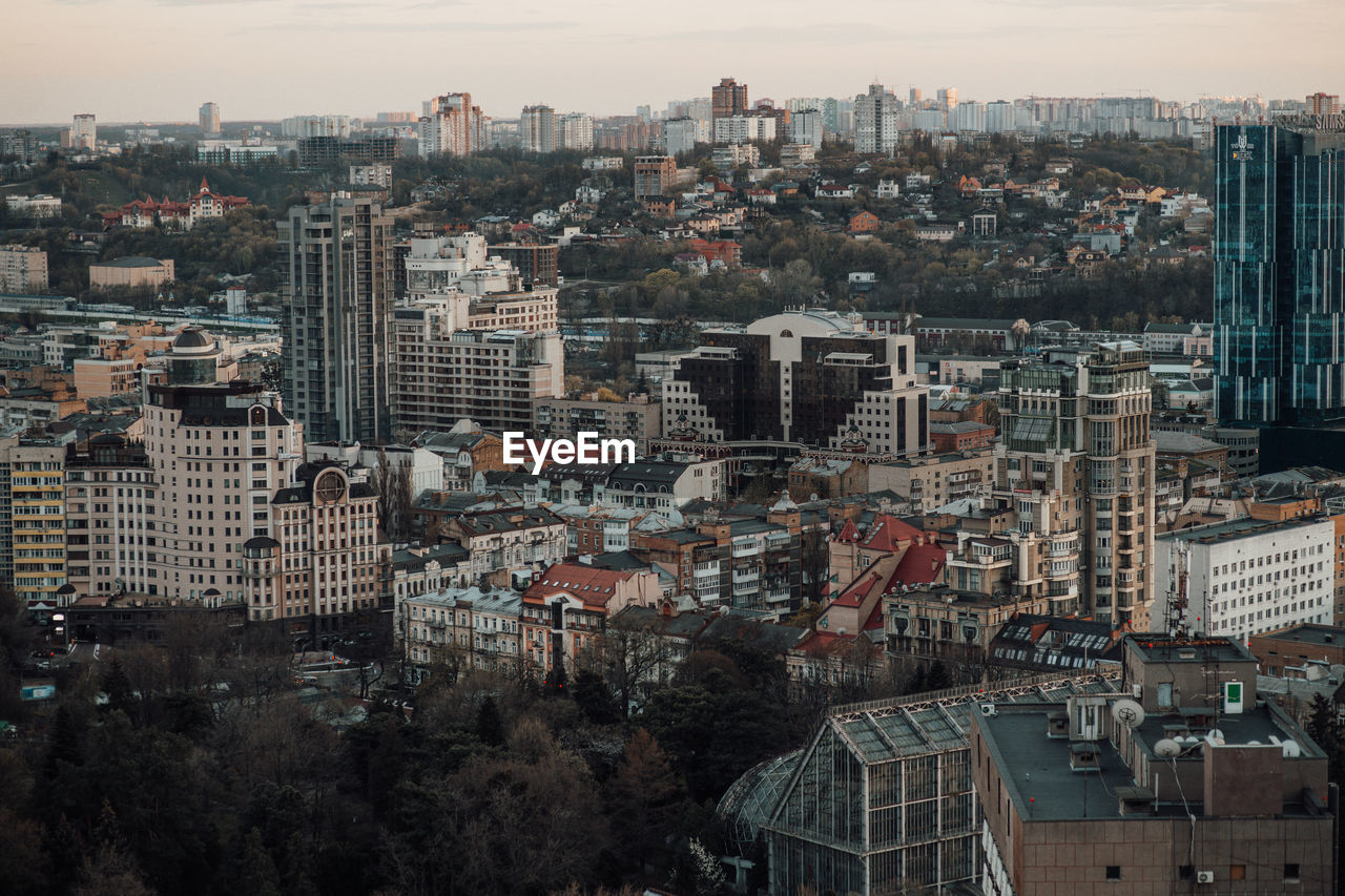 High angle view of buildings in city against sky