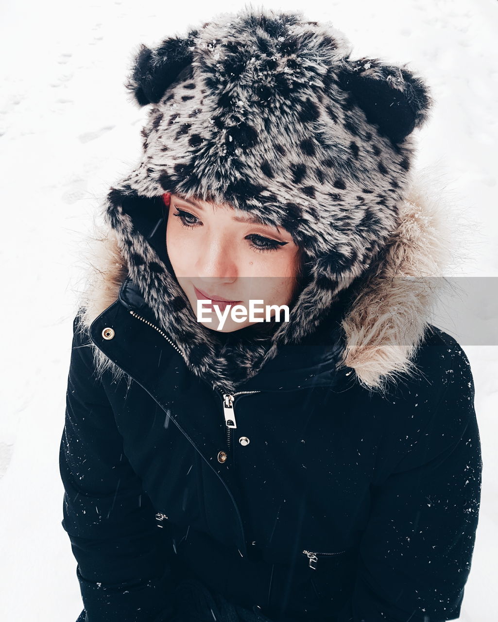 Close-up of beautiful woman in warm clothing during winter