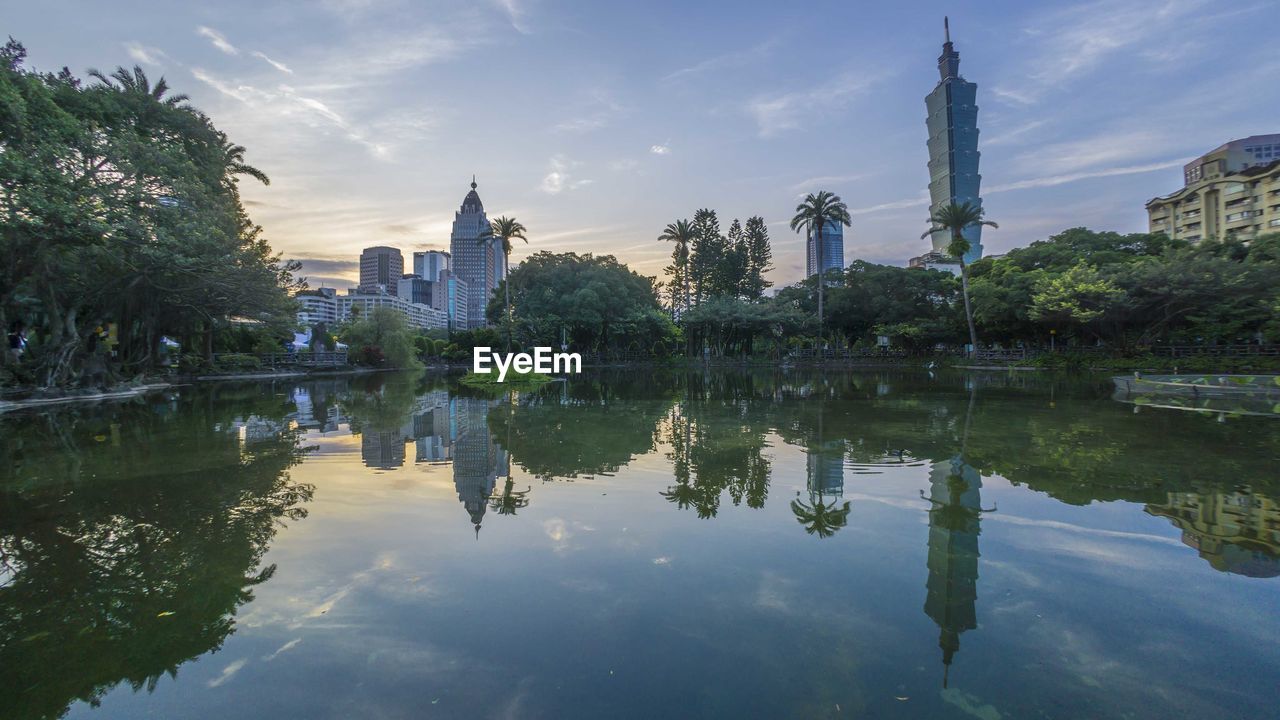 REFLECTION OF BUILDINGS IN LAKE WATER