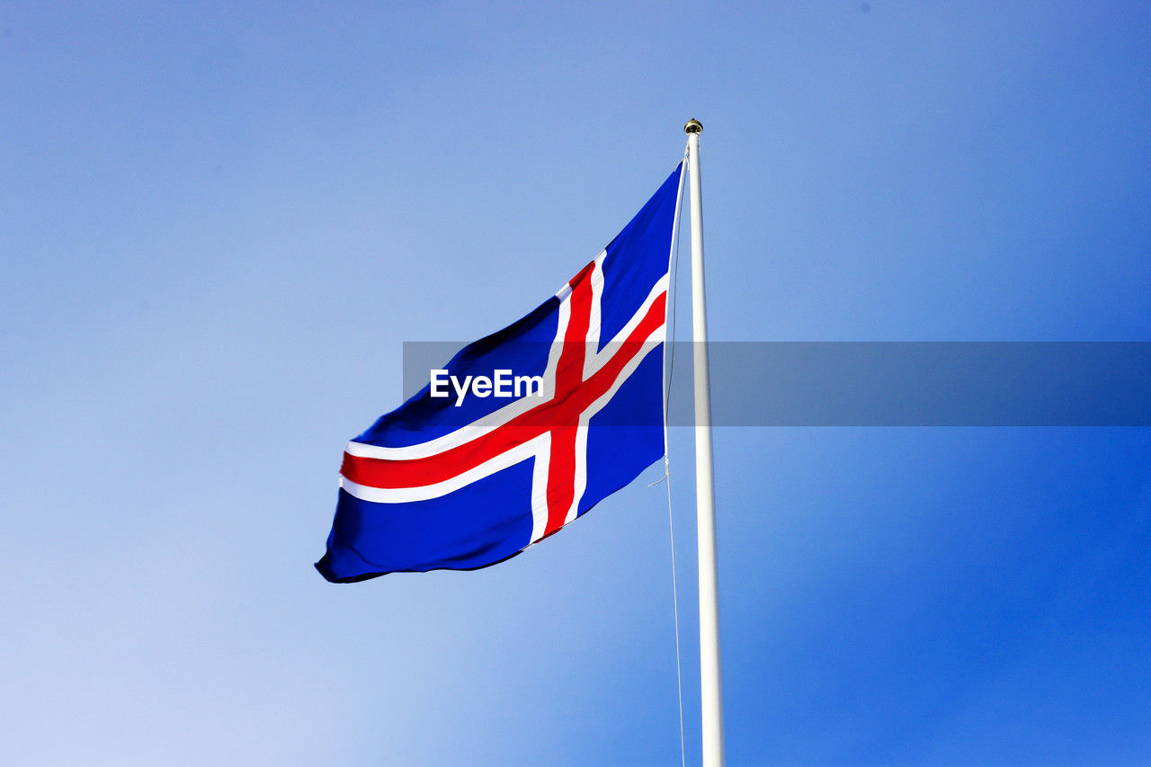 low angle view of flag against clear sky