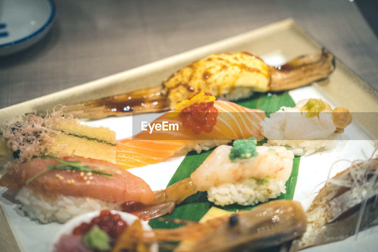 CLOSE-UP OF FISH SERVED ON PLATE
