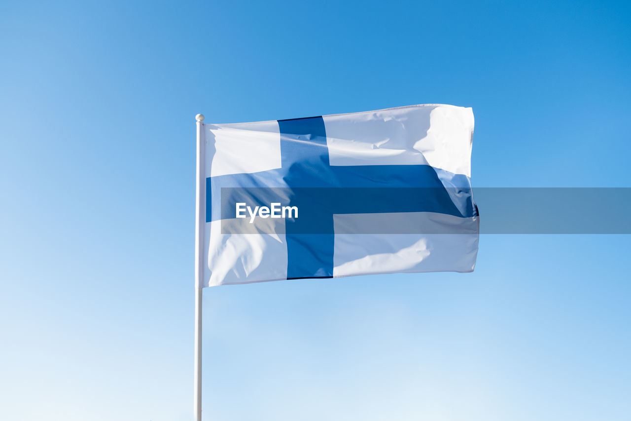 Flag of finland on blue sky background.