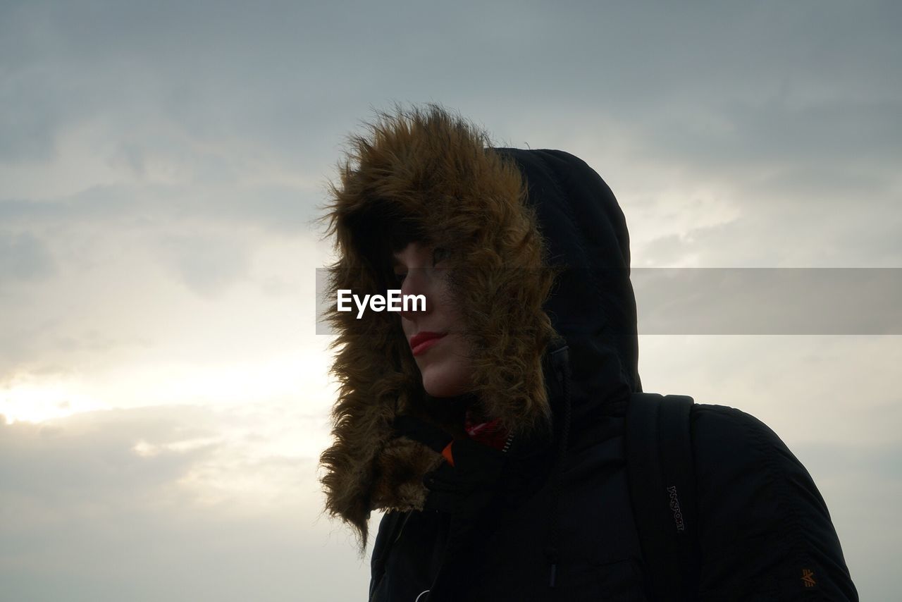 Portrait of man against sky at sunset