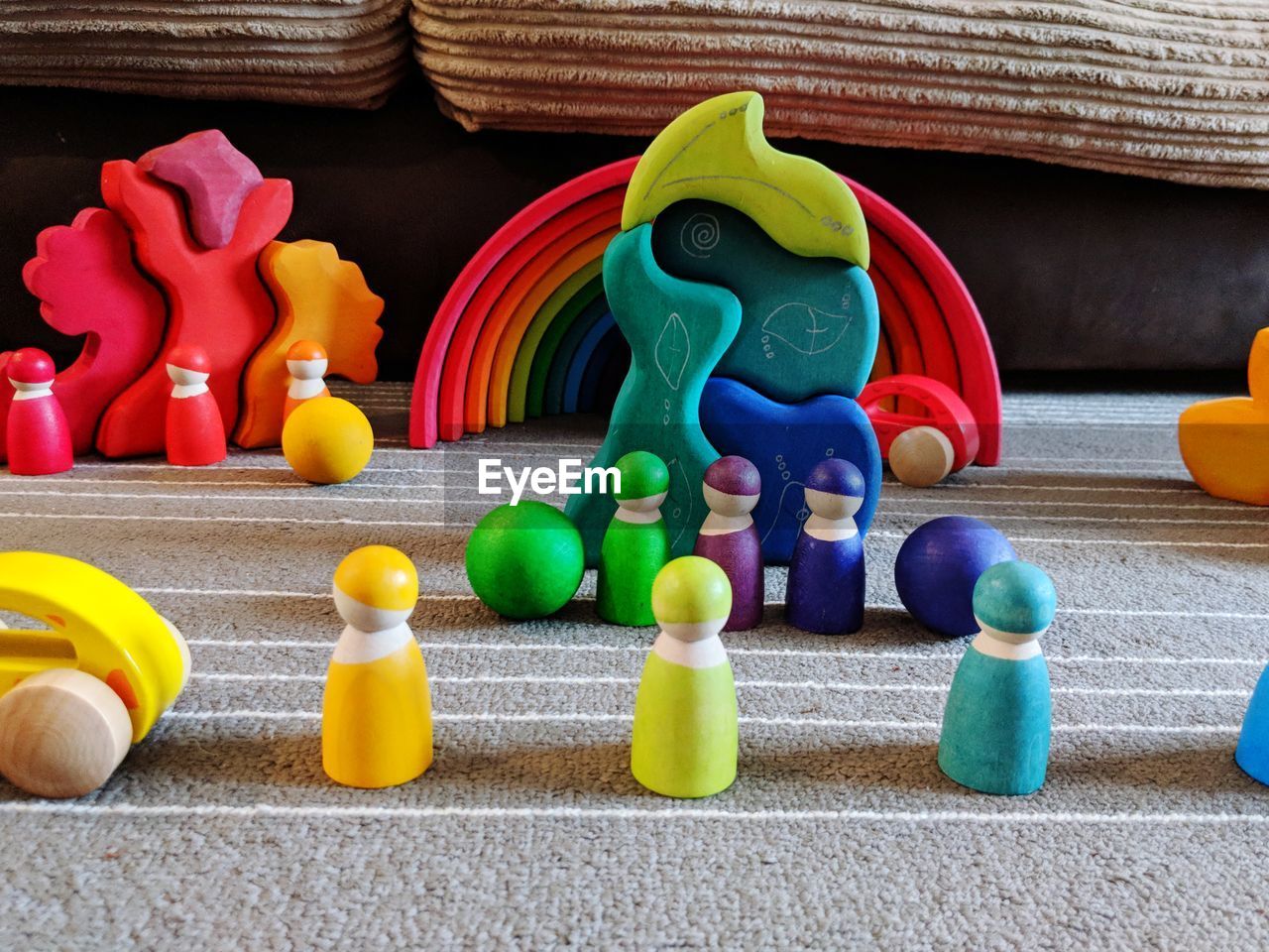 CLOSE-UP OF MULTI COLORED TOYS ON SHELF