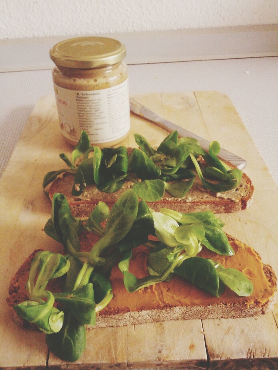 Sandwiches with corn salad on cutting board