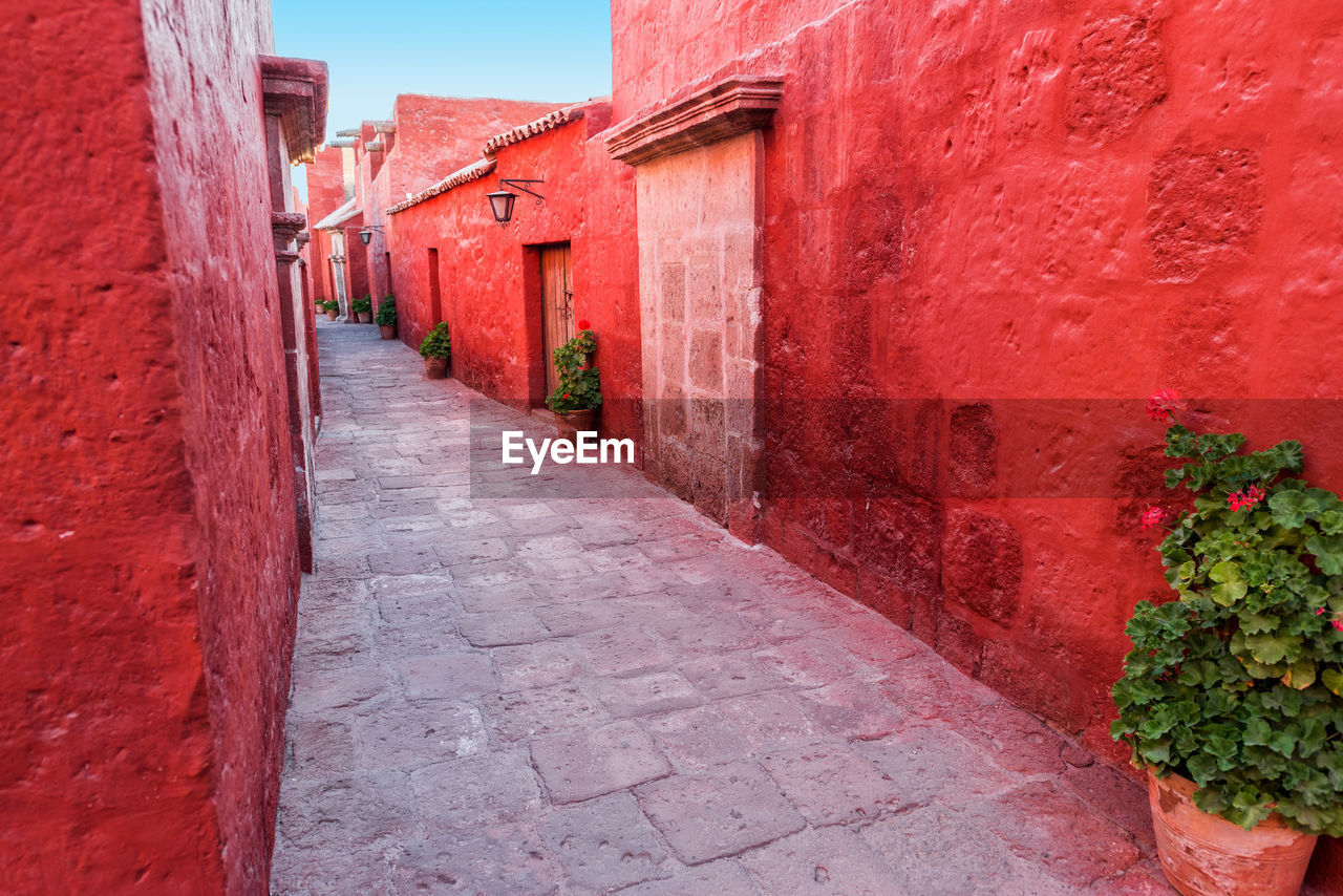 Alley amidst red houses at santa catalina monastery