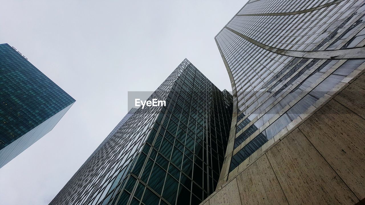 LOW ANGLE VIEW OF OFFICE BUILDING AGAINST SKY