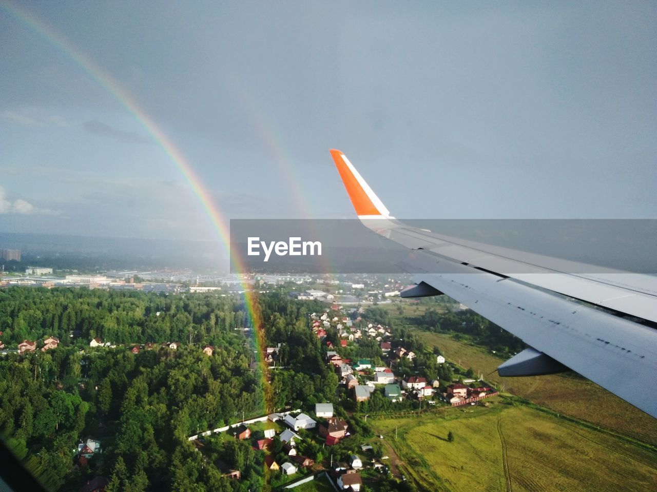 AERIAL VIEW OF RAINBOW ABOVE LANDSCAPE