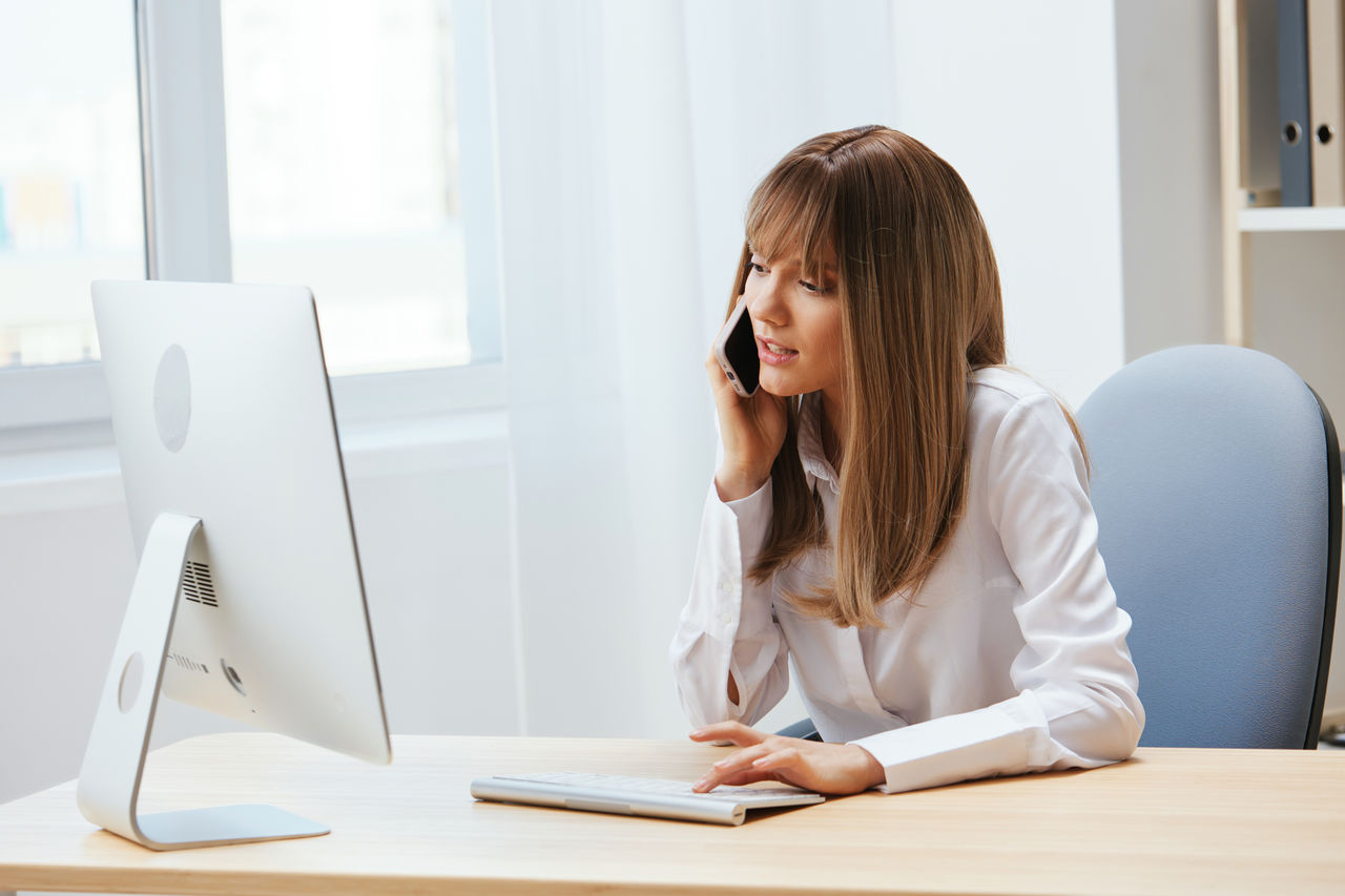 side view of businesswoman working at office