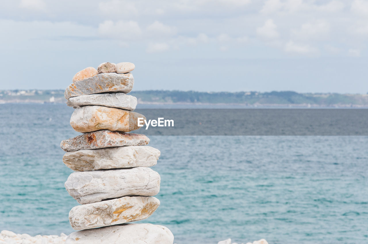 STACK OF STONES ON SEA SHORE