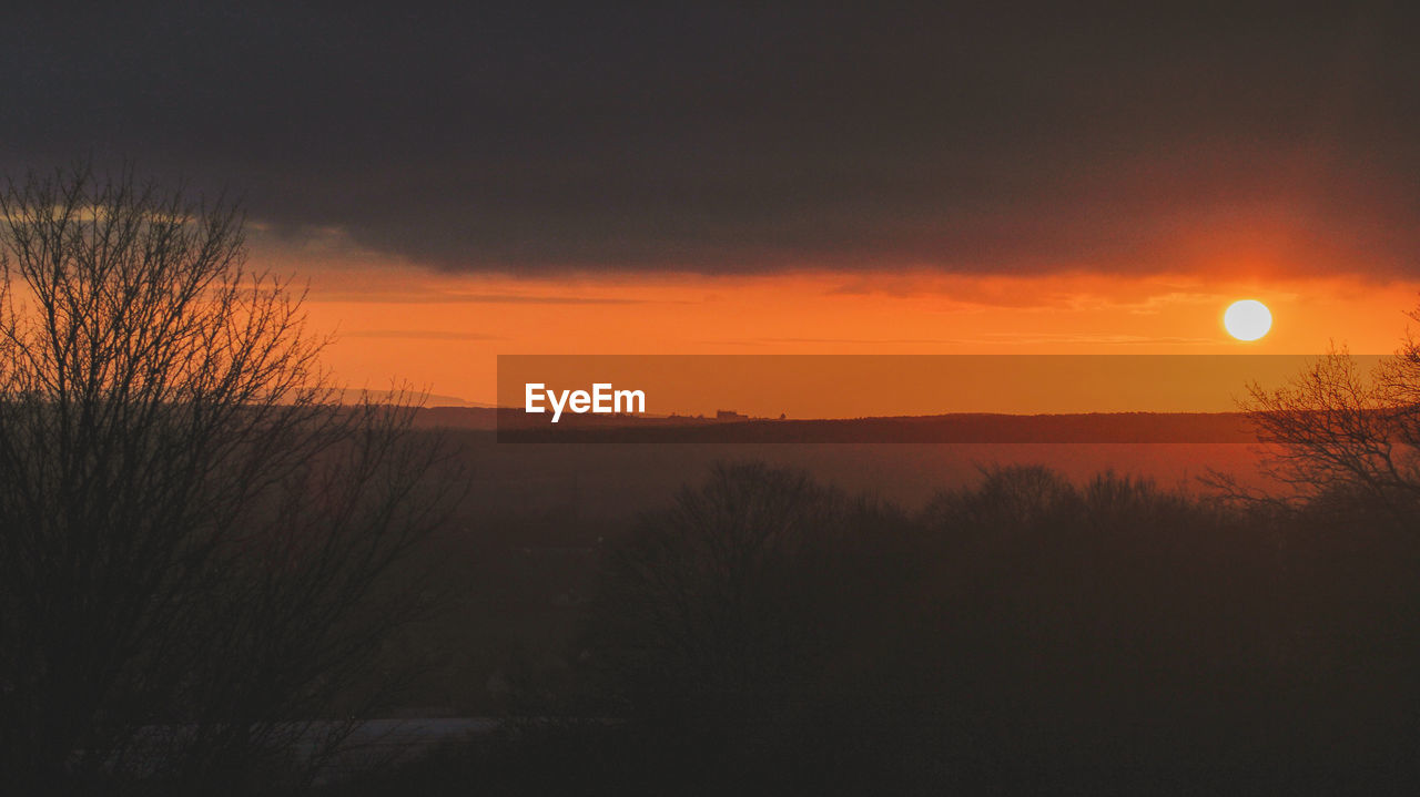 SCENIC VIEW OF SUNSET OVER LAND