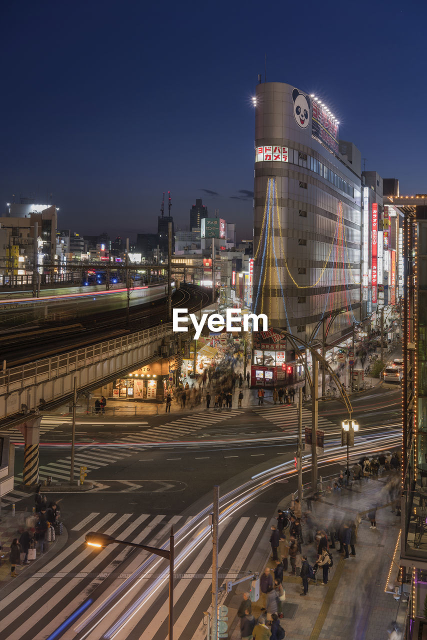 Ueno park street leading to the sightseeing street of ameyoko in tokyo at sunset.