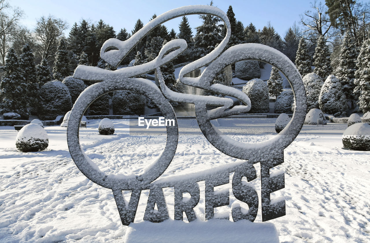 SNOW COVERED SCULPTURE ON FIELD
