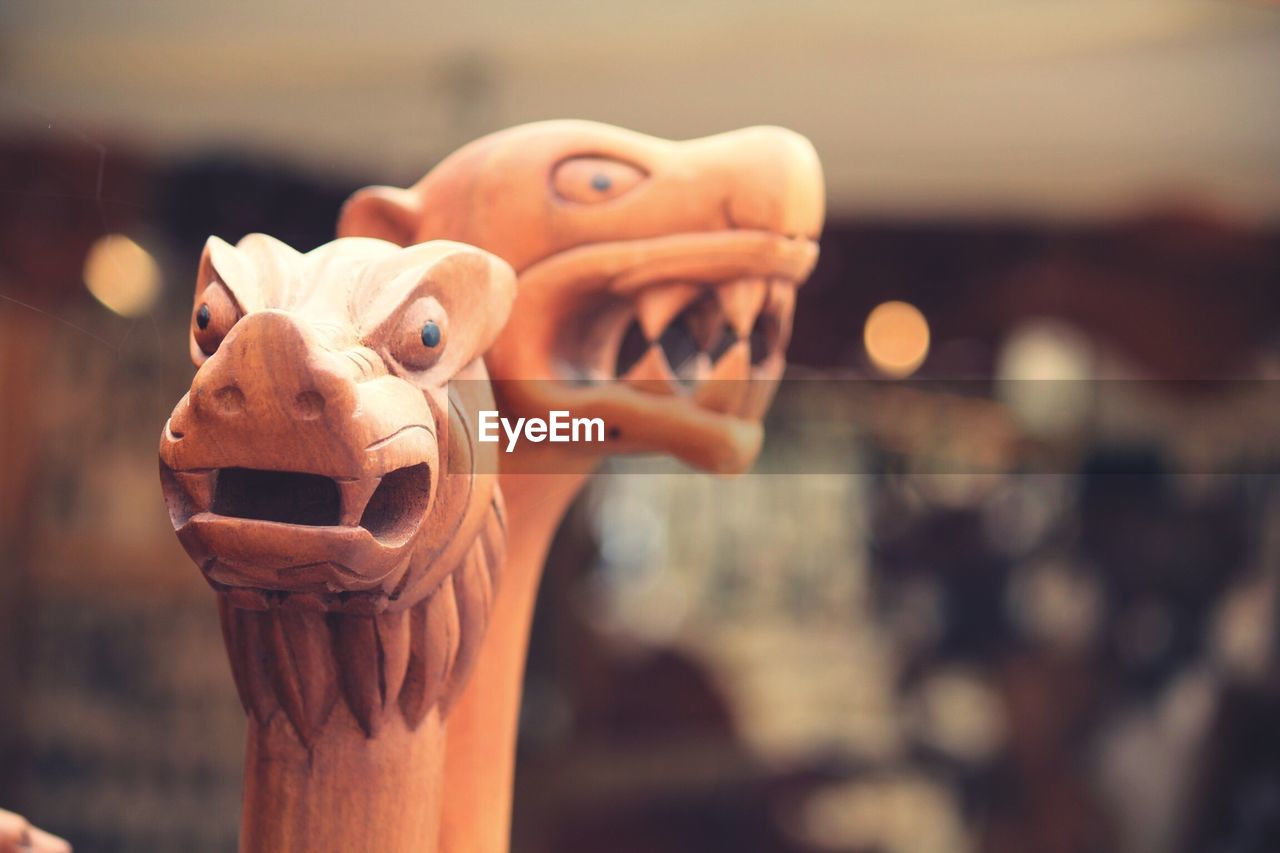 Close-up of wooden dragon sculptures