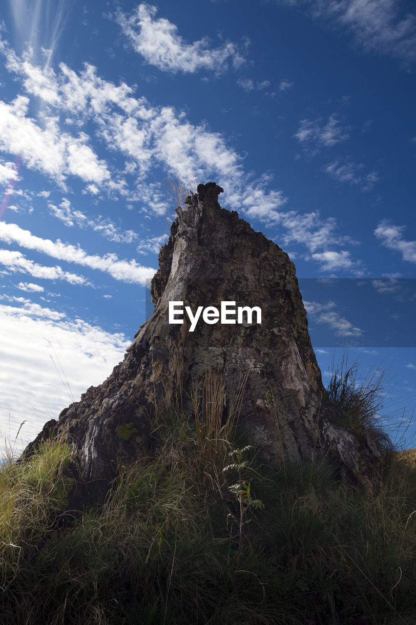 LOW ANGLE VIEW OF ROCK FORMATIONS ON LANDSCAPE AGAINST SKY