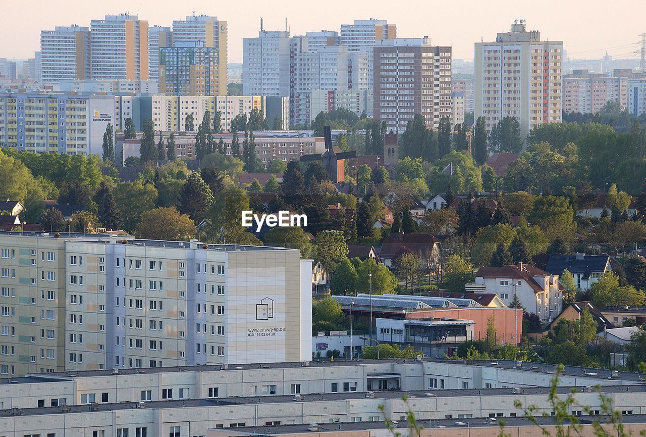 High angle view of buildings and trees in city